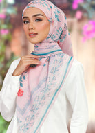 Model wearing printed stylized floral cotton tudung bawal - dusty pink