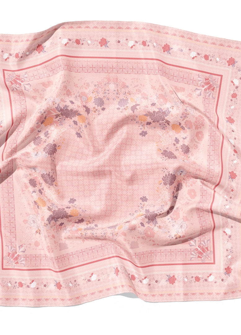 Pink floral patterned fabric on a white background