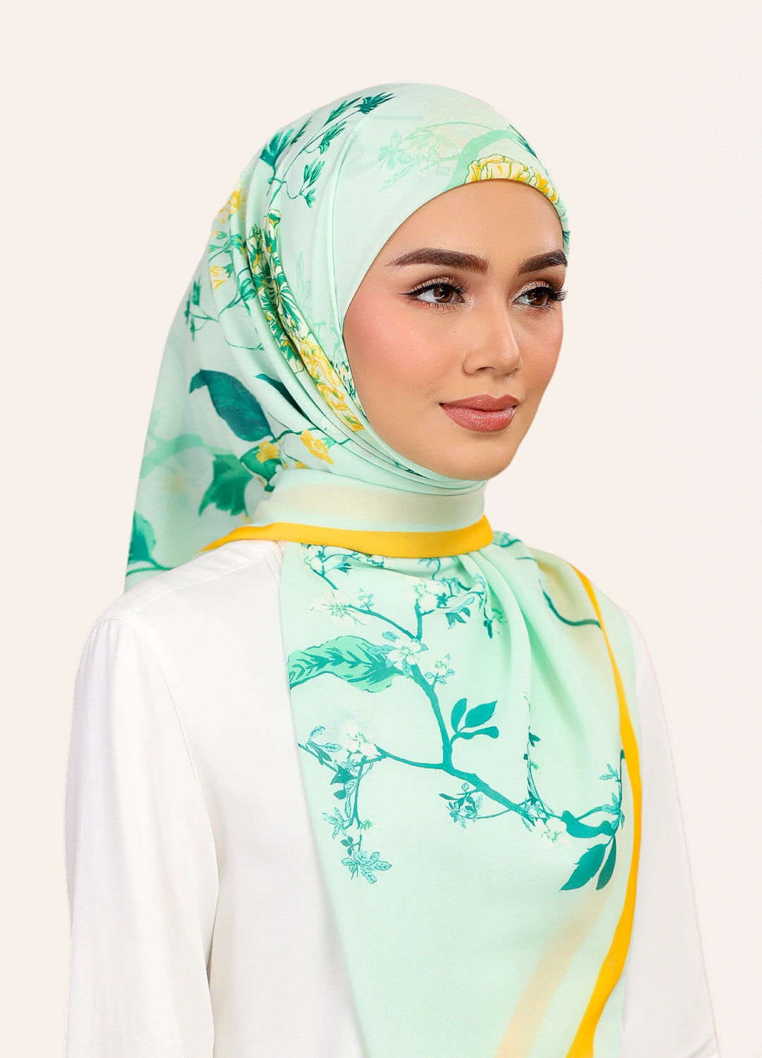 Model wearing printed intricate floral cotton voile bawal tudung - Light Green
