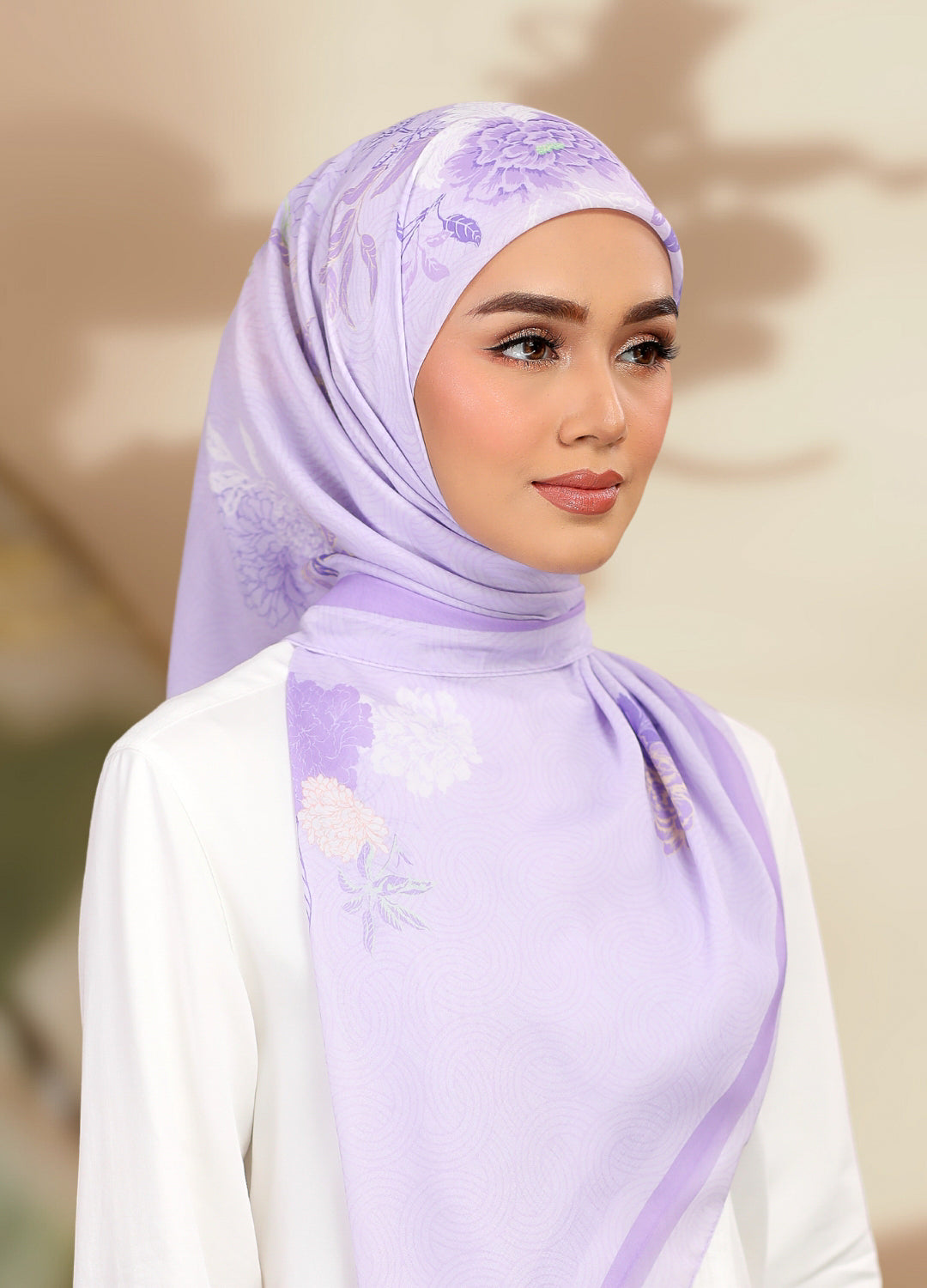 Model wearing printed peony floral tudung cotton bawal - purple