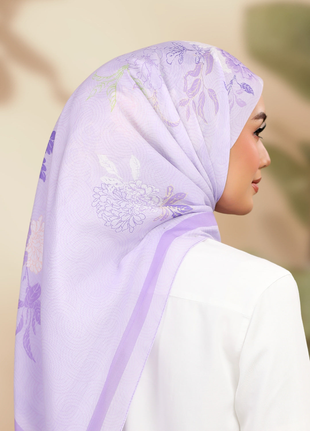 Model wearing printed peony floral cotton tudung bawal - purple