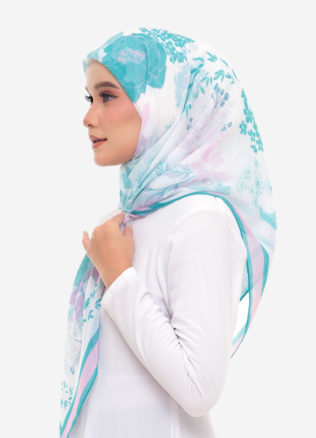 model wearing printed abstract floral cotton tudung teal