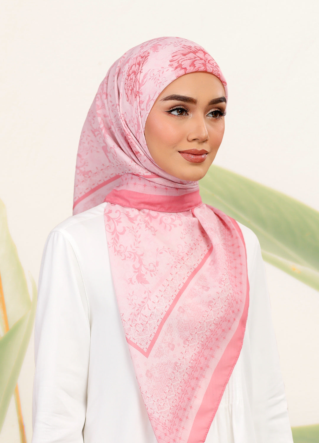 Model wearing printed filligree floral tudung bawal - salmon pink