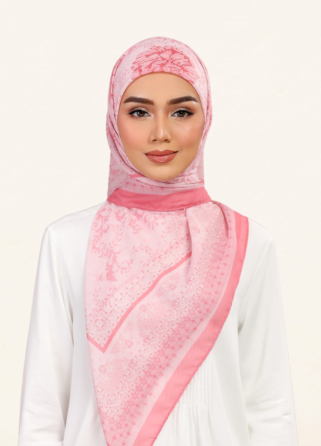 Model wearing printed filligree floral cotton voile tudung bawal in salmon pink