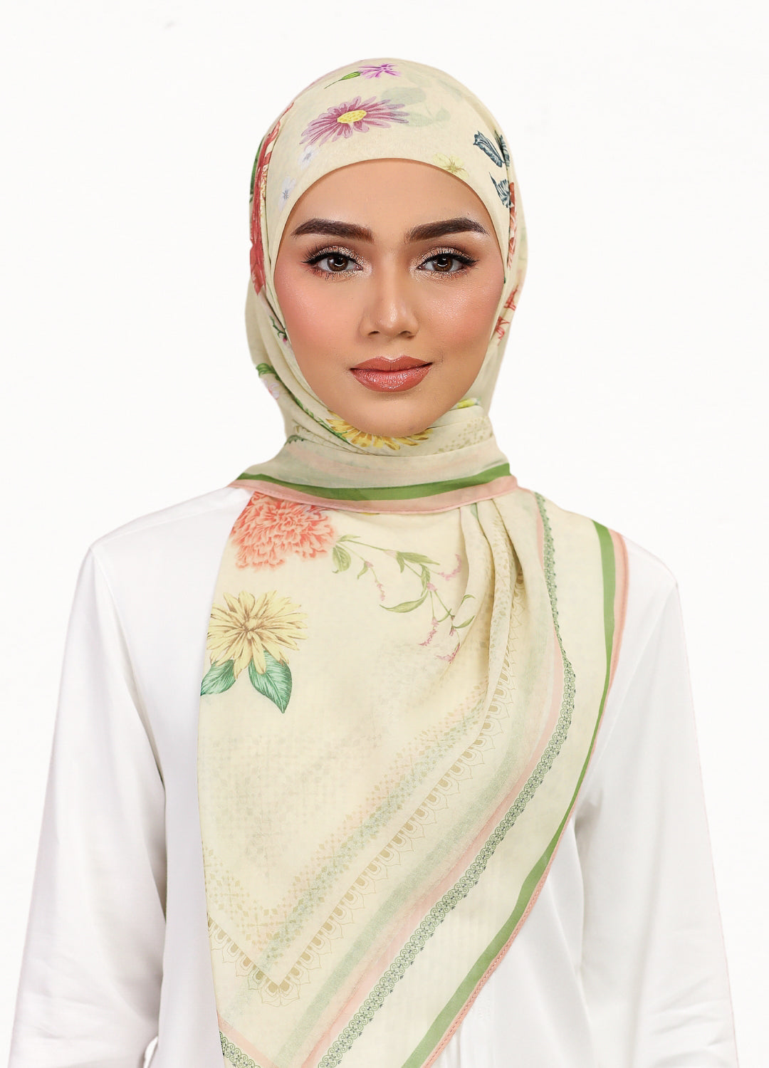 Model wearing printed botanical floral design tudung bawal in daisy yellow