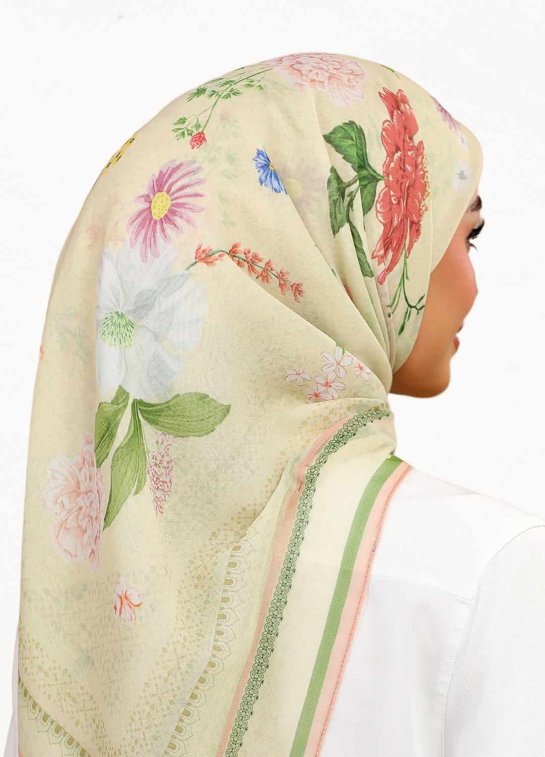 Model wearing printed botanical floral design cotton tudung bawal 3/4 back view