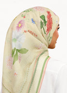 Model wearing printed botanical floral design cotton tudung bawal 3/4 back view