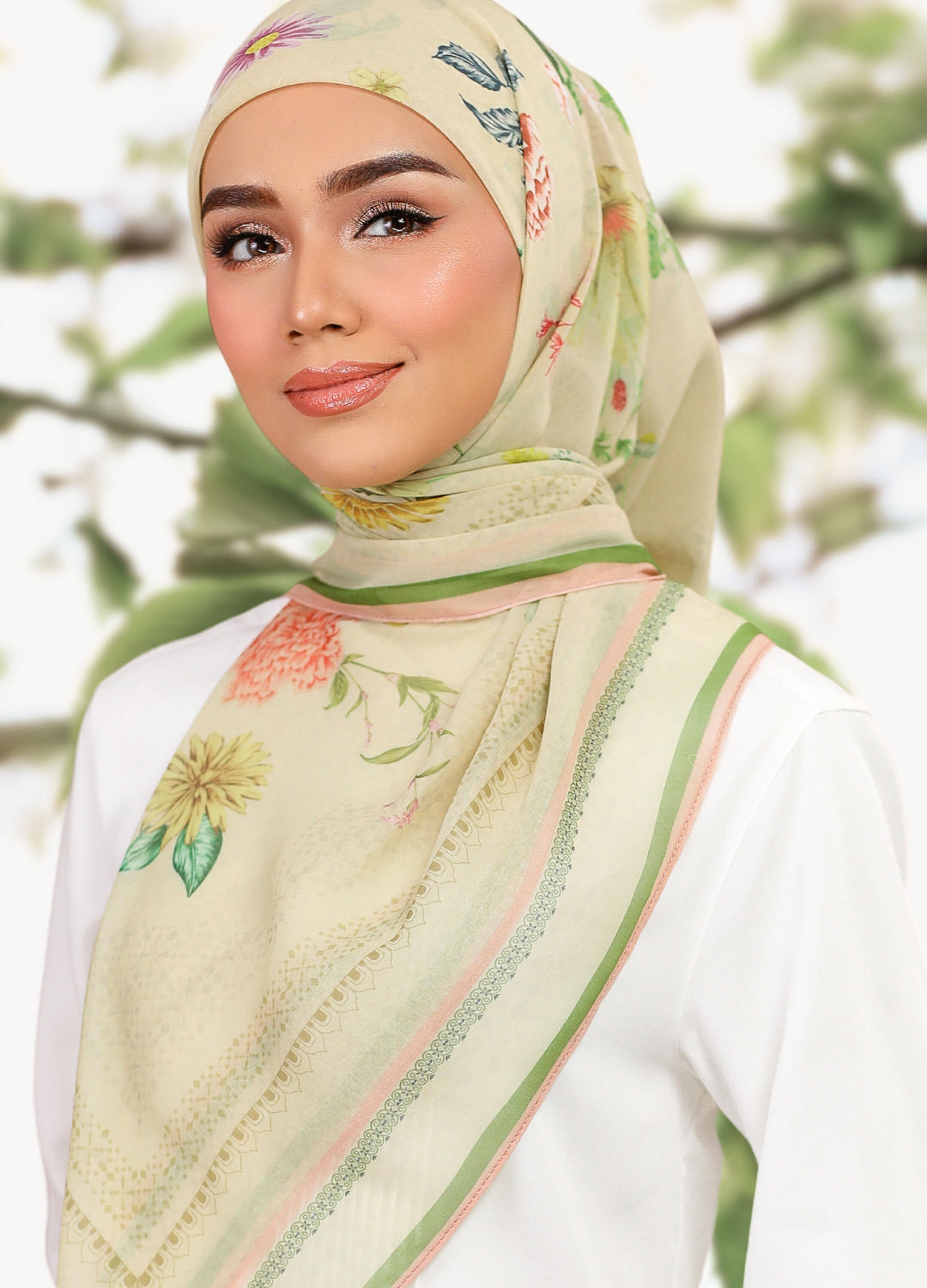 Model wearing printed botanical floral cotton tudung bawal