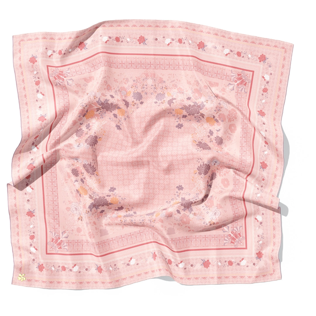 Pink floral patterned fabric on a white background