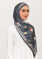 Model wearing printed botanical floral silk satin shawl tudung scarf - black