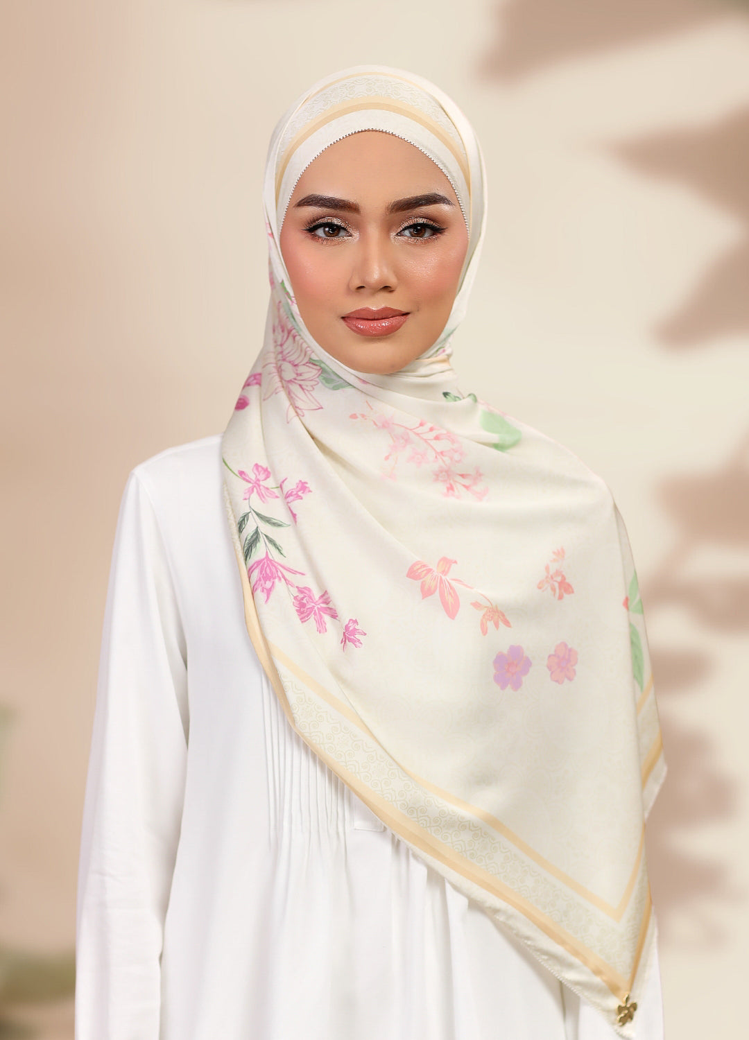 Model wearing printed satin silk shawl in beige