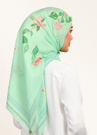 Model wearing printed hand drawn botanical floral cotton voile tudung bawal