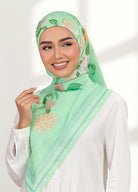 Model wearing printed hand drawn botanical floral cotton tudung bawal - green