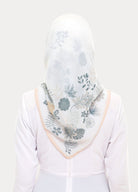 model wearing printed floral tudung bawal white