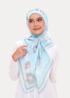 Model wearing printed cotton tudung bawal baby blue plain background