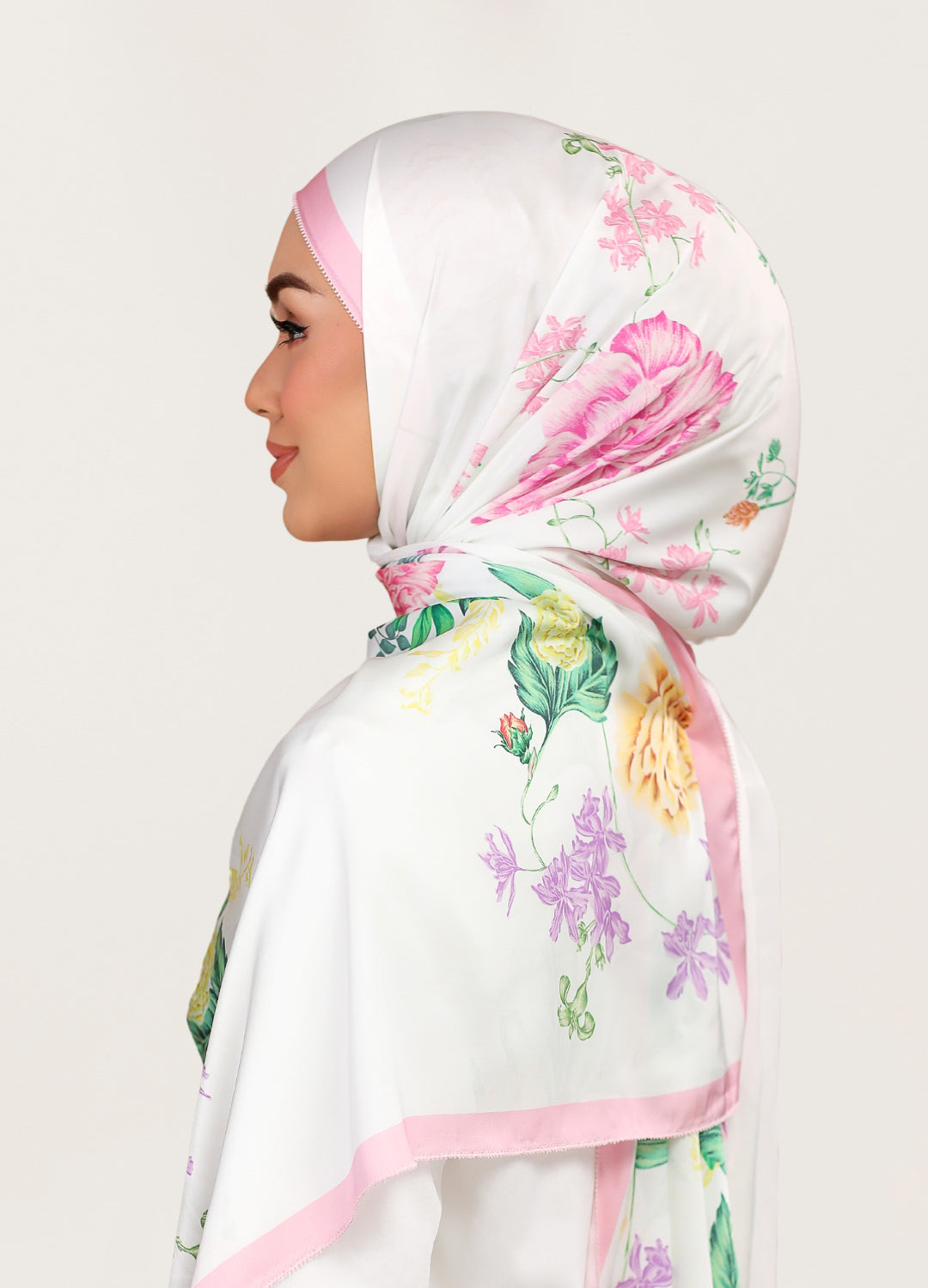 Model wearing printed botanical floral satin silk tudung shawl - white