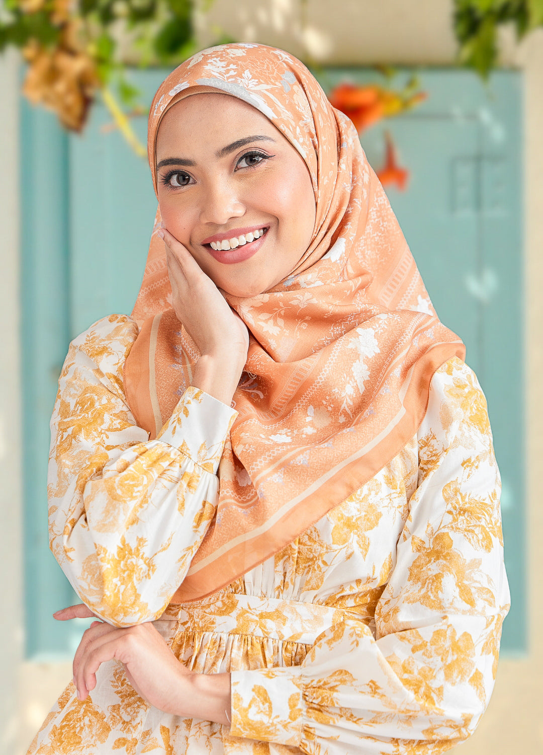 Women wearing floral top and hijab with blurred background