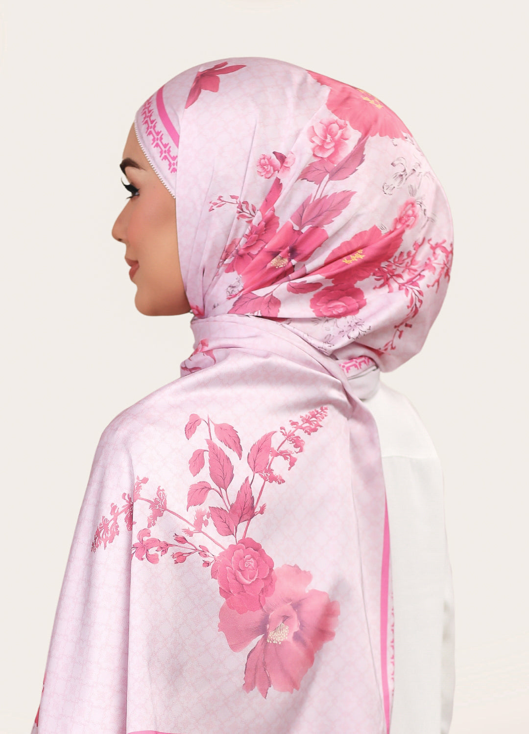 Model wearing printed satin shawl tudung - pink