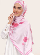 Model wearing printed floral silk satin shawl tudung - Light pink